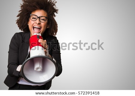 business black woman shouting on the megaphone Royalty-Free Stock Photo #572391418