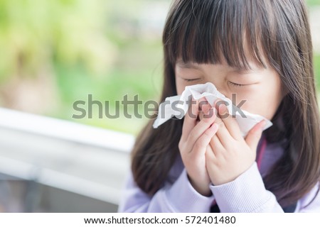 little girl get cold and blow her nose,  asian Royalty-Free Stock Photo #572401480