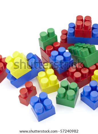 close up of child toy bricks construction on white background
