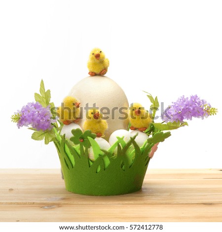Funny cartoon chick, eggs and handmade with colorful Easter holidays flower