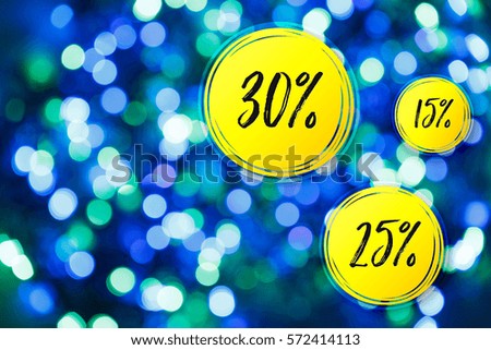 Blurred lights blue background. Sale discounts circles. Glittering christmas effect. Shimmering blur spots. Festive design.
