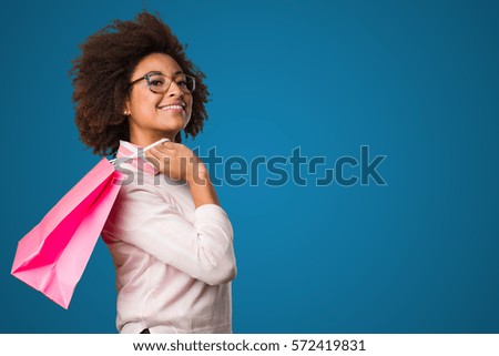 black woman holding shopping bags