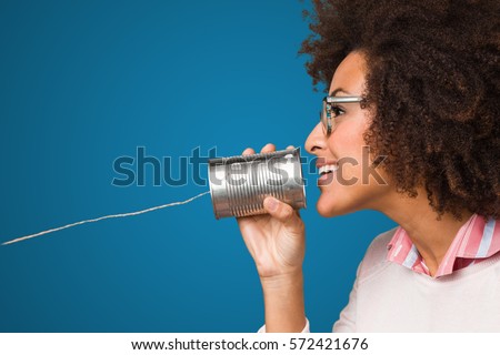 black woman holding a tin can Royalty-Free Stock Photo #572421676
