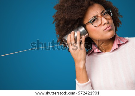 black woman holding a tin can Royalty-Free Stock Photo #572421901