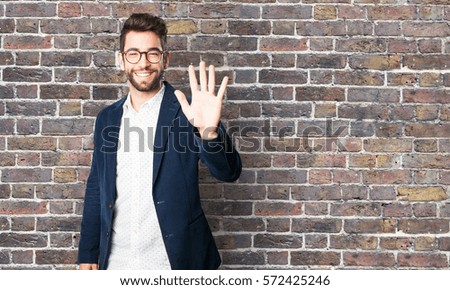 young man doing a number five symbol