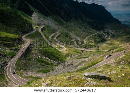 Landscape in Fagaras mountains in Romania, with Transfagarasan road. One of the most spectacular roads in the world. Royalty-Free Stock Photo #572448619