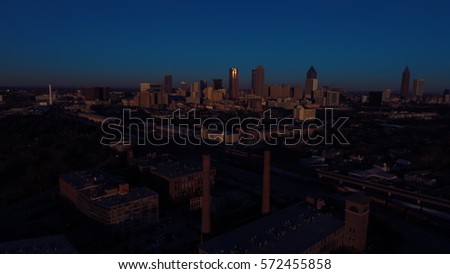 As the Sun Rises over the City of Atlanta, a Very Faint light emerges,  Aerial View