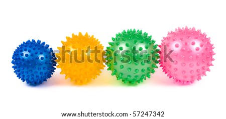 four coloured massage balls over white background Royalty-Free Stock Photo #57247342