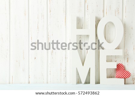 Word home of the decorative letters on wooden table
