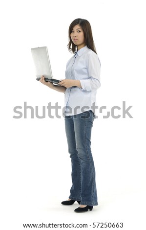 Portrait of a lovely young female using laptop against white background