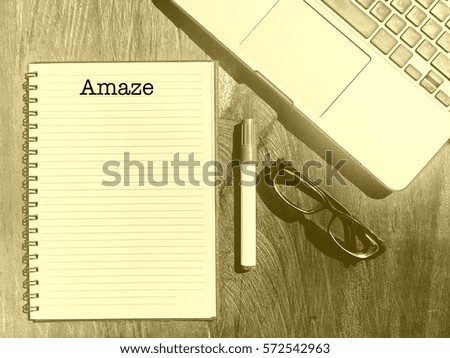 Amaze, Positive Words  starting with letter A on a handbook with note book, marker pen and notebook.  Yellow Vintage and classic background mood with noise.