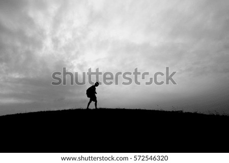 journey man walking alone in the world