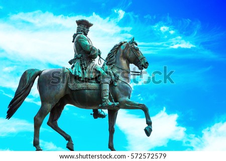 Background with man on horse statue in Vienna, Austria