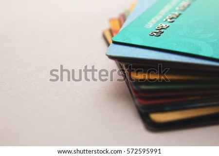 stack of bright colorful discount plastic cards, close up view, horizontal background with copy space