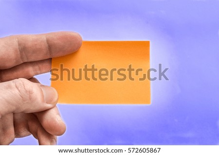 Sticker, Card Mock-Up Men's hands holding a blank card on a lavender background.