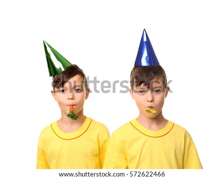 Cute birthday boys with party hats on white background