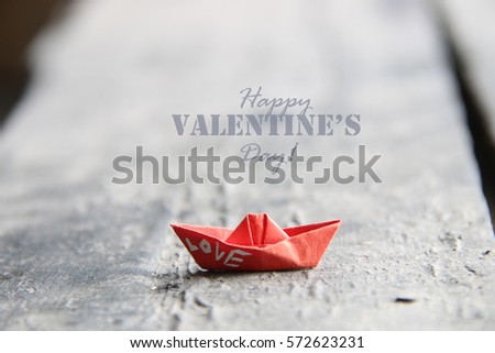 Happy Valentines day card with paper boat