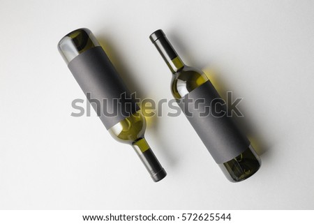 Top view of two wine bottles, mixed with wines type and a bottles colors