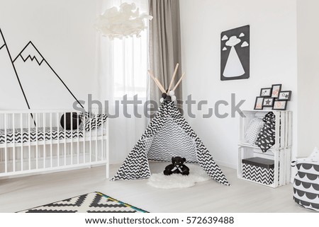 Spacious black and white baby room decoration