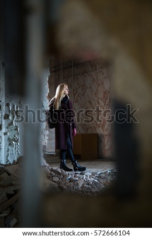 Beautiful girl wanders through the abandoned hospital, Blonde in an abandoned building,old Soviet laboratory