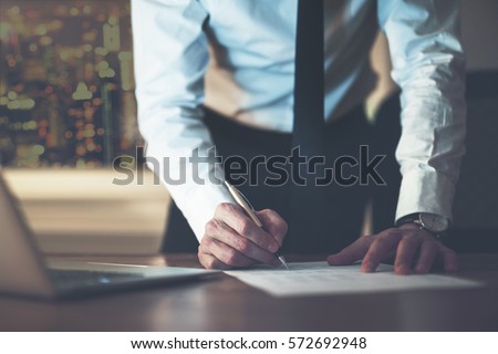 Close up business man signing contract making a deal, classic business