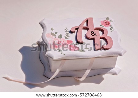 The handmade casket with marriage couple's monogram