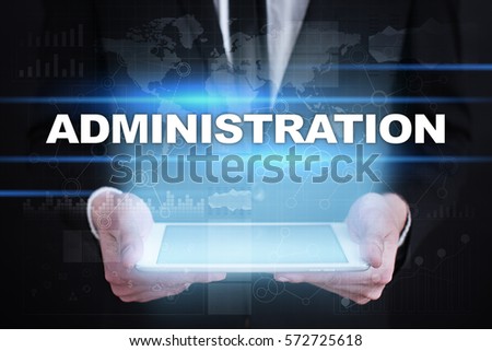Businessman holding tablet PC with administration concept.