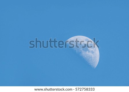 moon in blue sky during the day