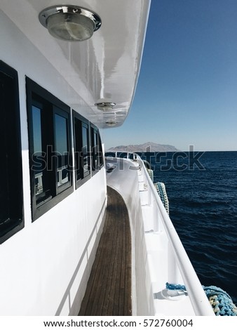 Picture of luxury white yacht deck with sea view on a sunny day