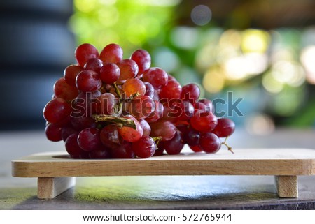 Grapes on Japanese tray style. Royalty-Free Stock Photo #572765944