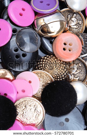 Buttons background. Colored shiny clothing button texture. Colored sewing buttons pattern concept wallpaper. Mixed colors. Studio photo texture photography.