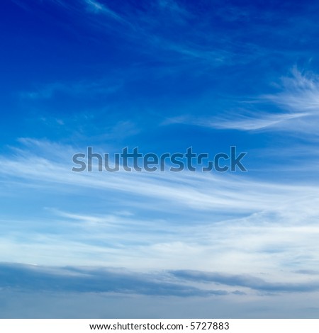 The blue sky and beautiful white clouds.