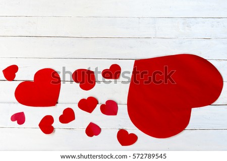 Heart valentine and white wooden background.Top view.