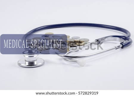 a stethoscope with piles of coins - health care cost concept