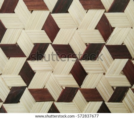texture of Thai bamboo weaving in dark and light brown color in star pattern 