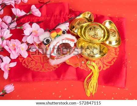 chinese traditional dancing lion with Gold ingot,Chinese calligraphy Translation:good bless for money