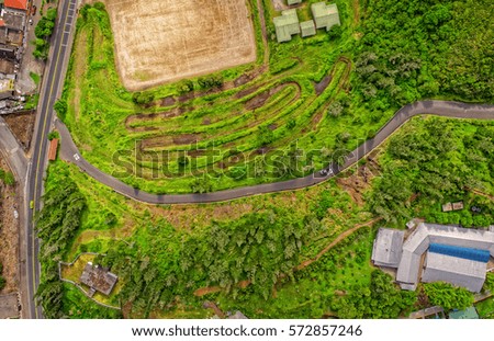 Overall Aerial View Of Small Green Fields In Banos De Agua Santa, Latin American Town, Tungurahua Province, In The Daylight, South America

