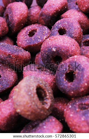 
Dog pet food texture. Dog Meat food background pattern texture. Red round animal food.
Studio photo texture photography