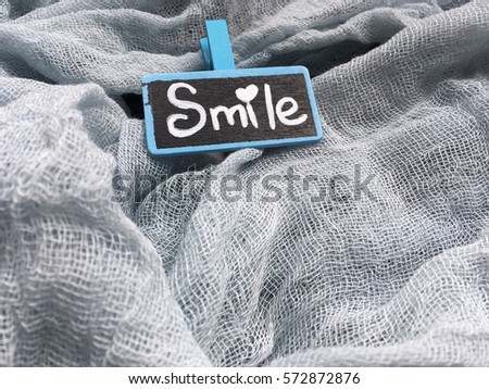 Chalkboard on rustic background with space for  your text. Blue chalkboard with word smile. Positive instagram wallpaper. Valentines morning. 
