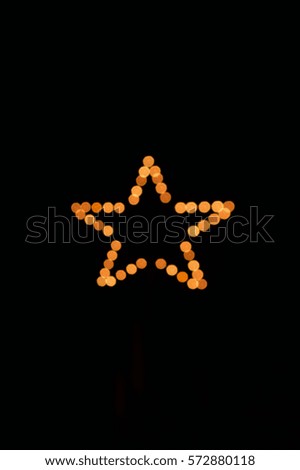 Sparkling star made of fireworks on black background