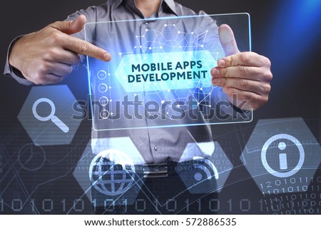 Business, Technology, Internet and network concept. Young businessman showing a word in a virtual tablet of the future: Mobile apps development