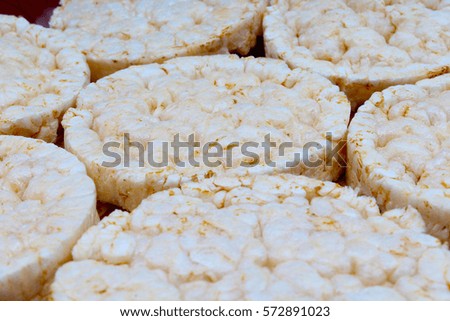 Stack of puffed whole grain crispbread. Rice cake puffed rice texture.Round rice cakes background. Corn crackers. Rice galettes. Studio photo texture photography.