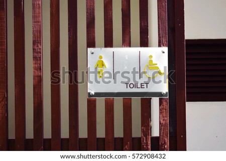 The toilets for men and people with disabilities in public.
