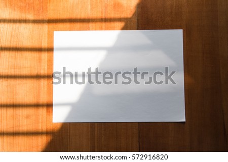 White blank paper on a wooden floor