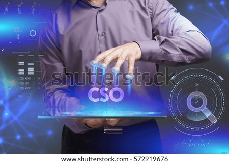 Business, Technology, Internet and network concept. Young businessman shows the word on the virtual display of the future: CSO
