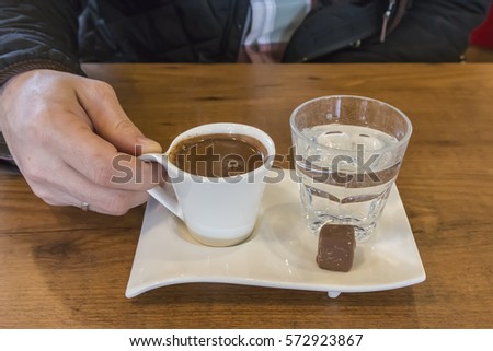 Turkish coffee and served with water