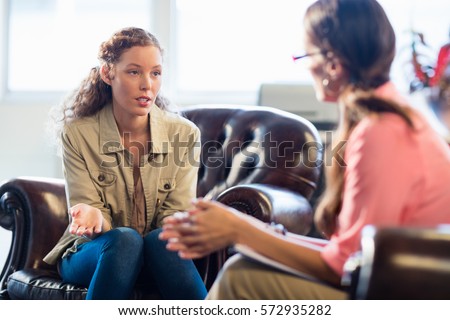 Psychologist having session with her patient in office Royalty-Free Stock Photo #572935282
