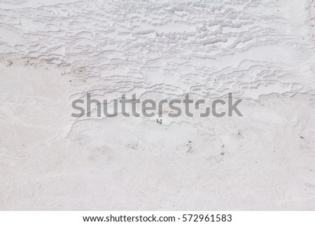 White Travertine. The view across a white travertine terrace in Pamukkale, Turkey. The site is a UNESCO World Heritage Site.