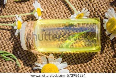 A chamomile tincture in a small bottle. Selective focus. 