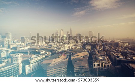 Aerial London view on a foggy day from St Paul's cathedral - vintage styled photo